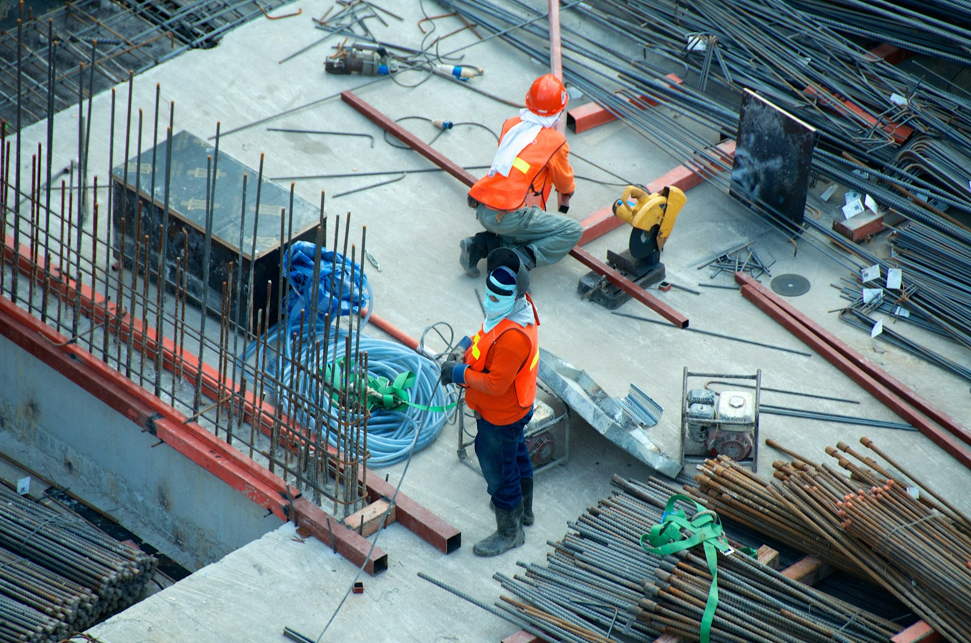 Construction workers reviewing work on an active building site